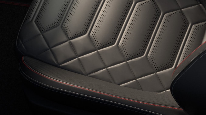 Premium seat in Ebony with full Sensico® and red stitching